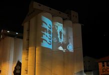 Silos lit blue in support